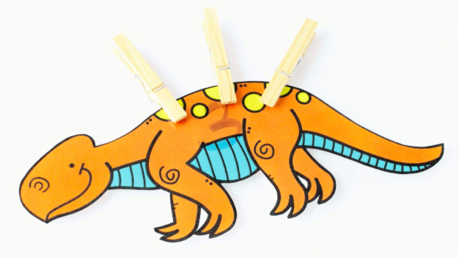 A dinosaur adorned with colorful clothes pegs attached to its body, creating a whimsical and playful appearance.