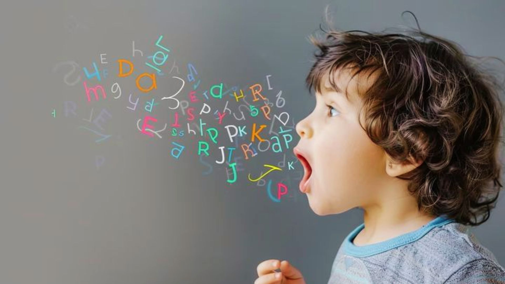 A young boy exhaling letters from his mouth, symbolizing challenges in speech development.
