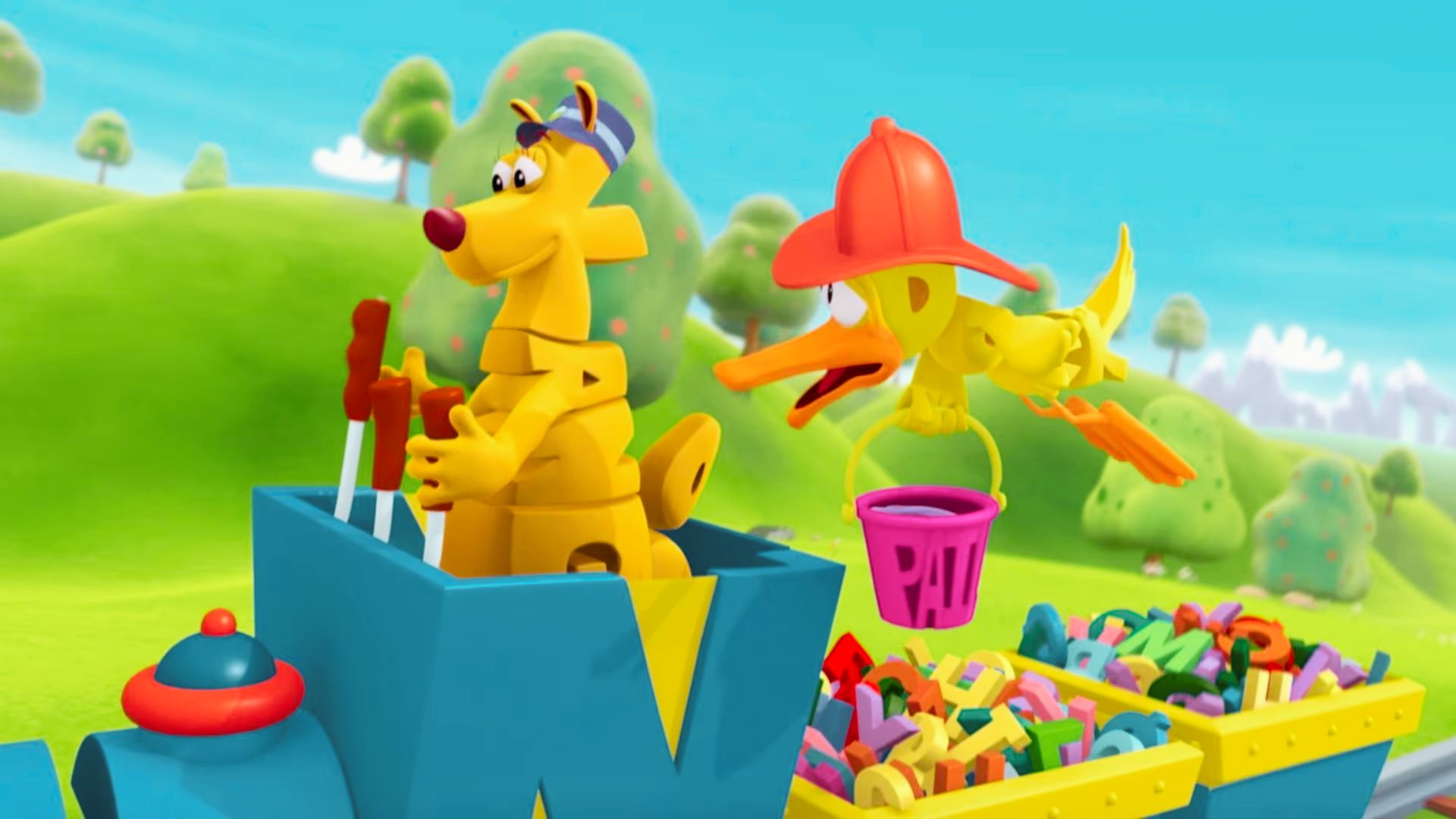 A cartoon character joyfully rides a train filled with colorful toys, set in the playful world of WordWorld.