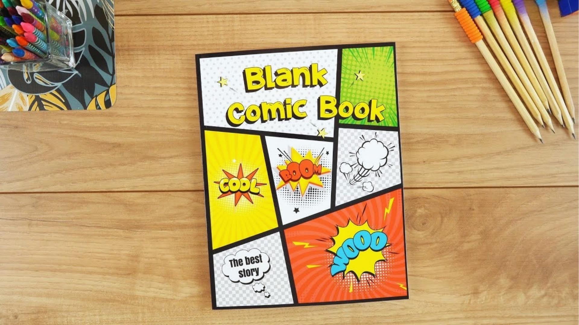 Blank comic book on wooden table with colored pencils, markers, creative drawing station.