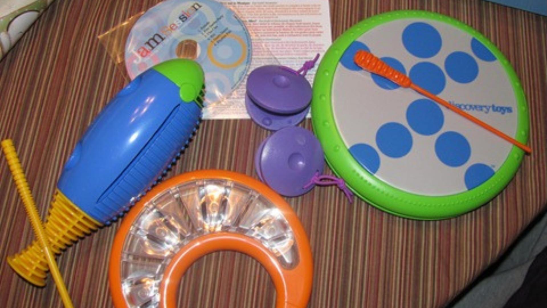 Kids musical instrument set with drum, tambourine, castanets, shaker, jam session CD.