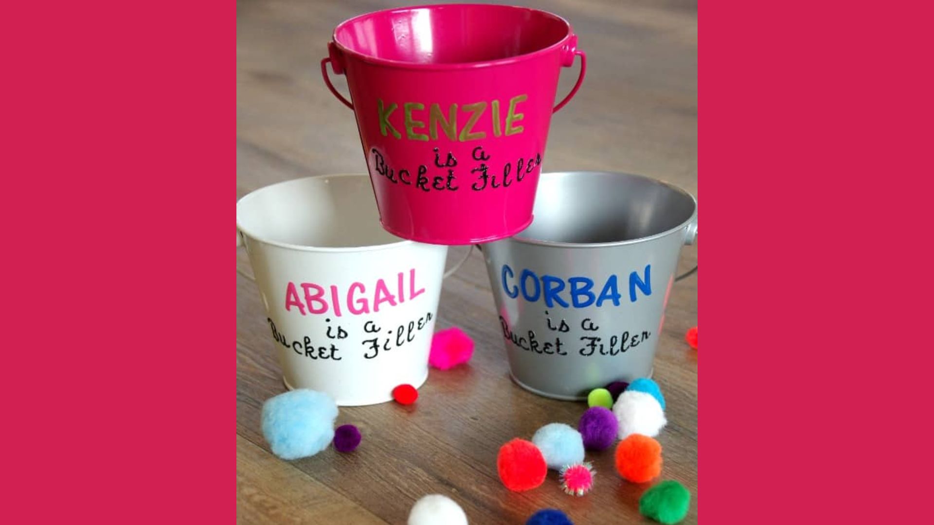 Three personalized mini metal buckets in pink, white, and silver.