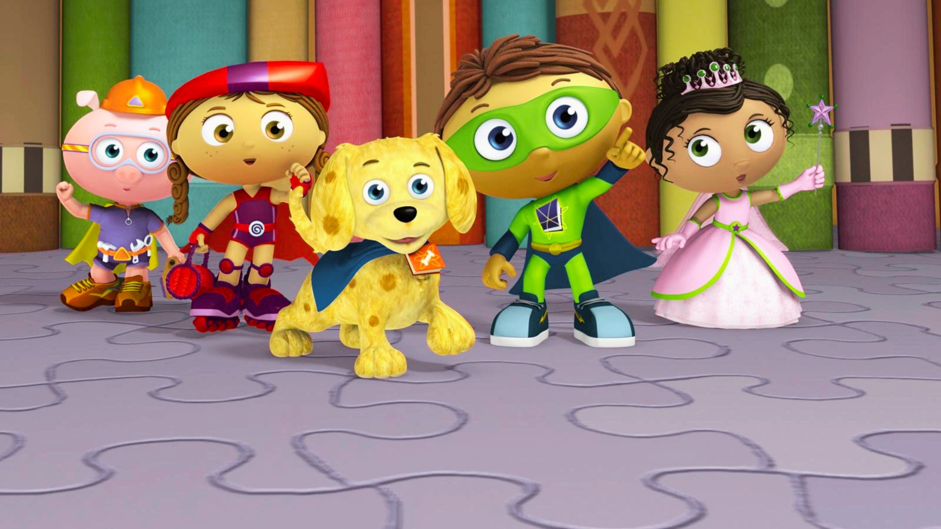 Children dressed in colorful superhero costumes, including Super Why!, posing playfully for the camera.
