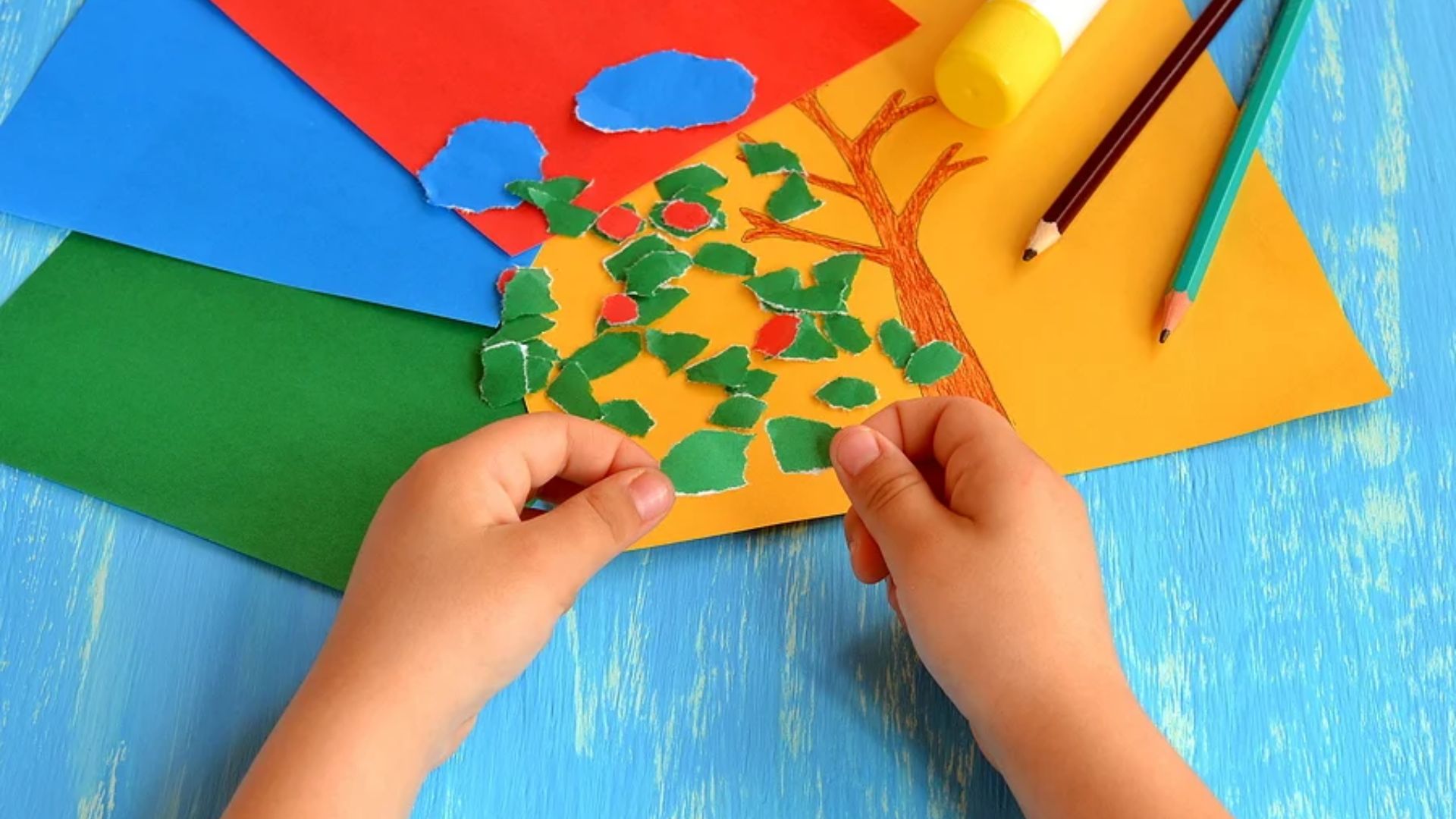 Creative anger management activity for kids using paper tearing and gluing to make tree art for emotional expression