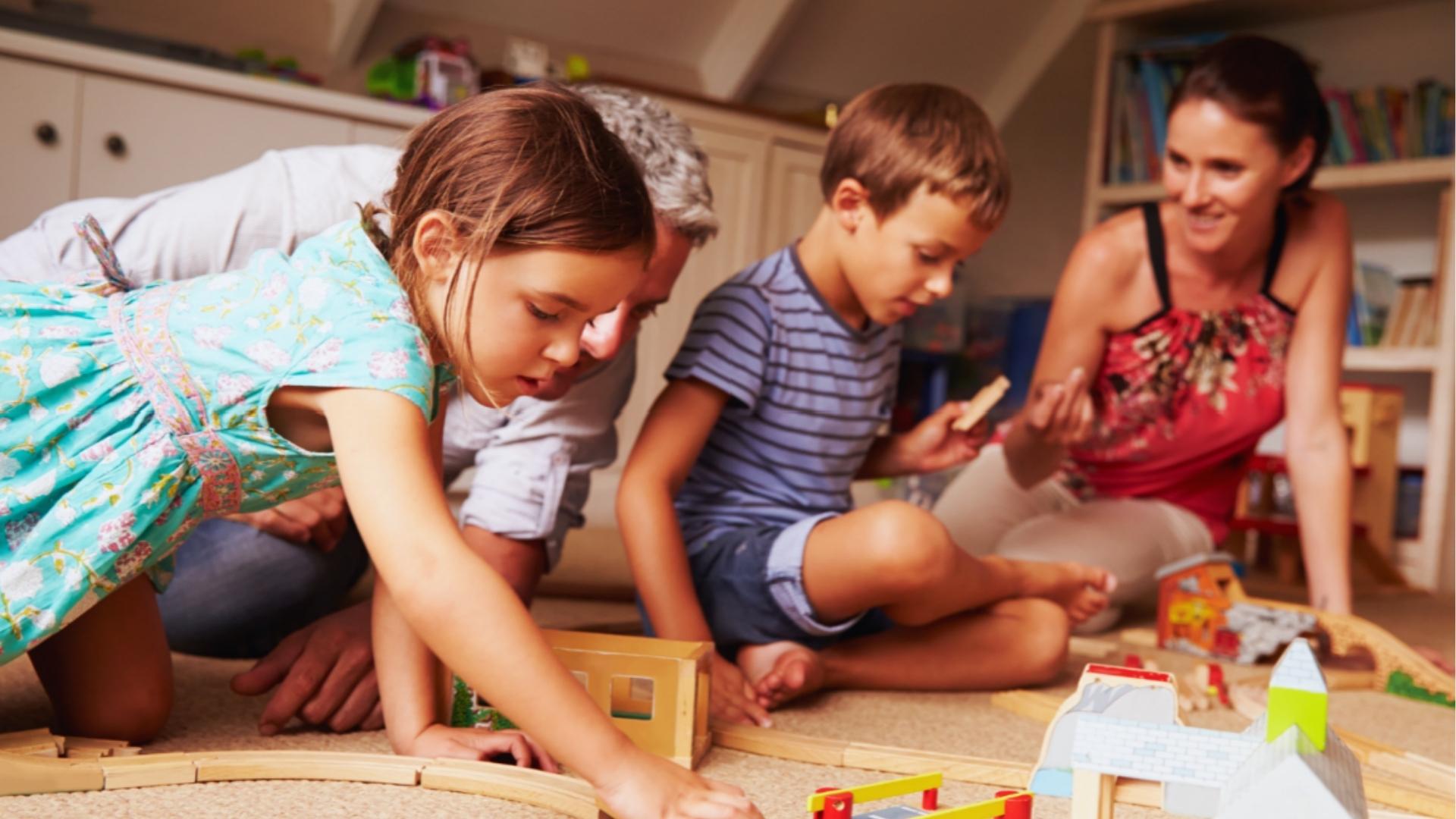 Parents and kids enjoying a fun playdate together indoors while playing and bonding in a friendly and inclusive environment