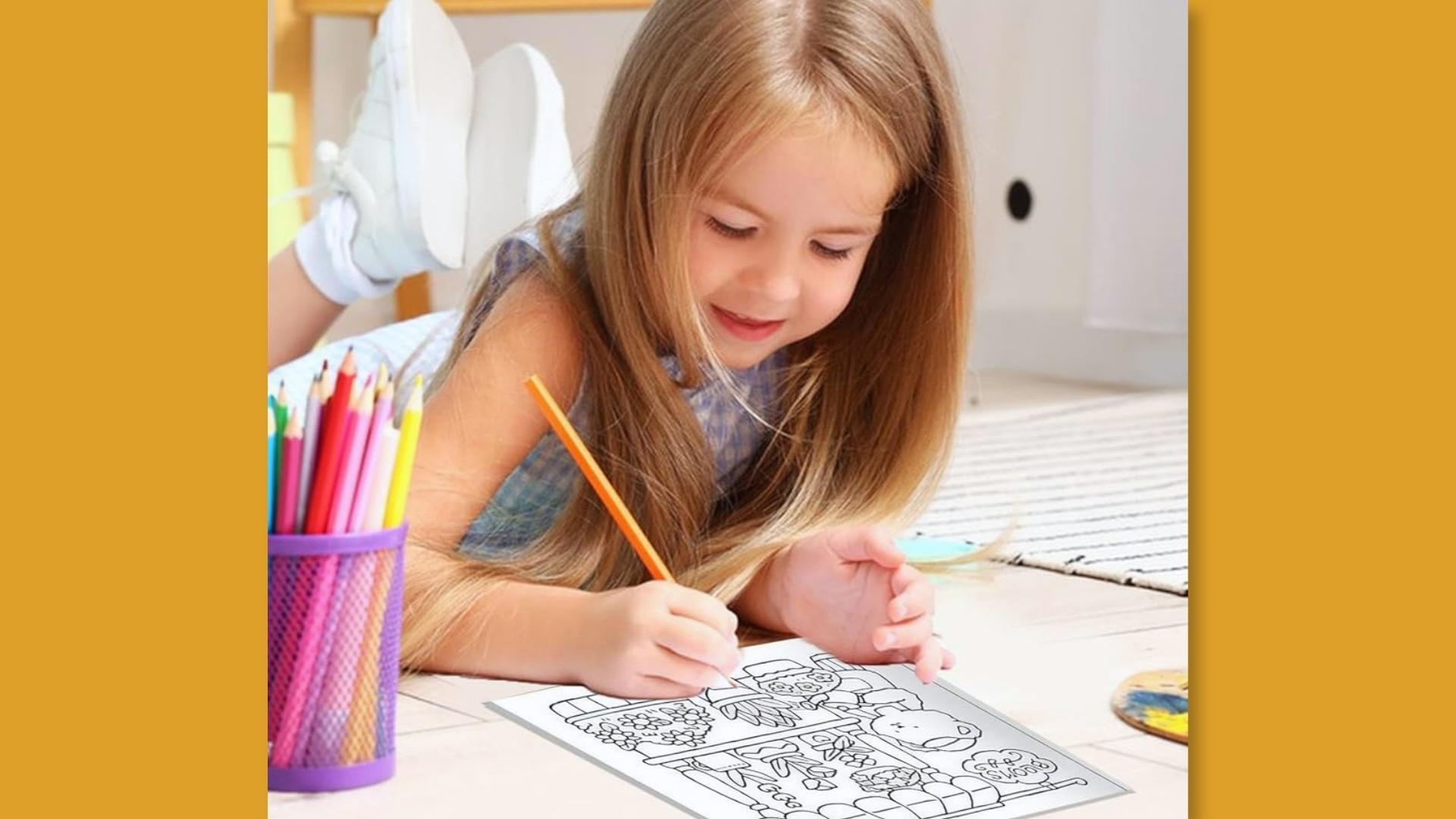 Girl lies on floor coloring page, cup of colored pencils, white sneakers, creative.